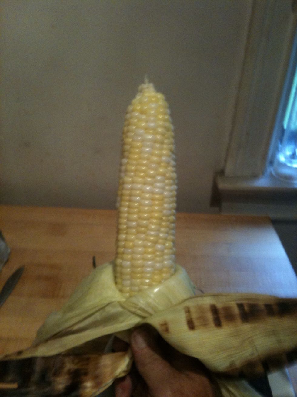 CAUTION HOT!!! Now peel back the husks. Watch out it will release a lot of HOT steam!! Lather with butter, salt and pepper or whatever you like.