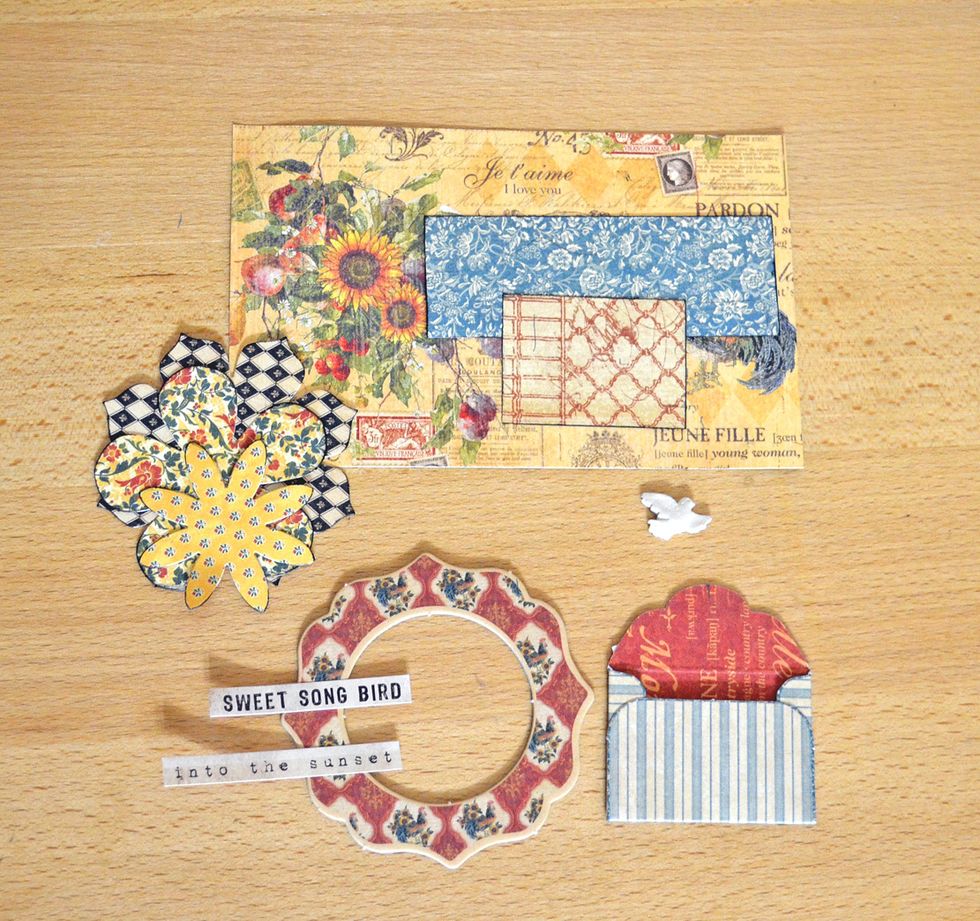 Cell 2. This cell will simply decorate.  Select the most appropriate decorations and place them in a cell. I chose chipbord, flowers and pieces of paper