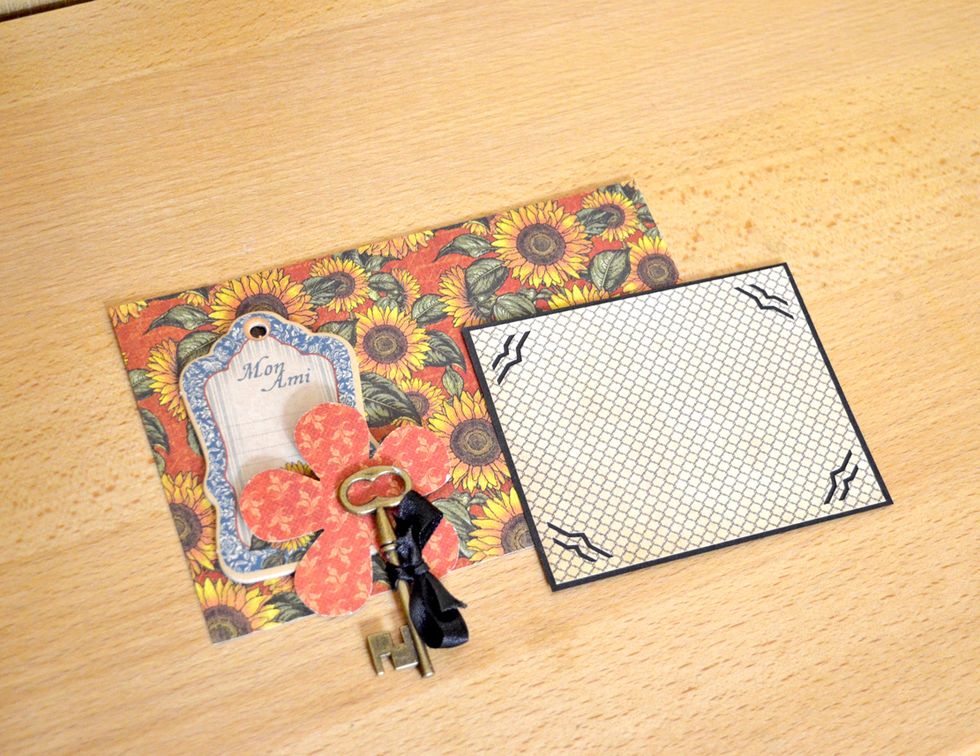 Cell 7. Make a background for photo and decorate this cell. Use chipboard. key, ribbon and flowers