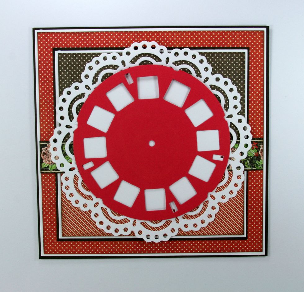 Center and attach another diecut from Tim Holtz.