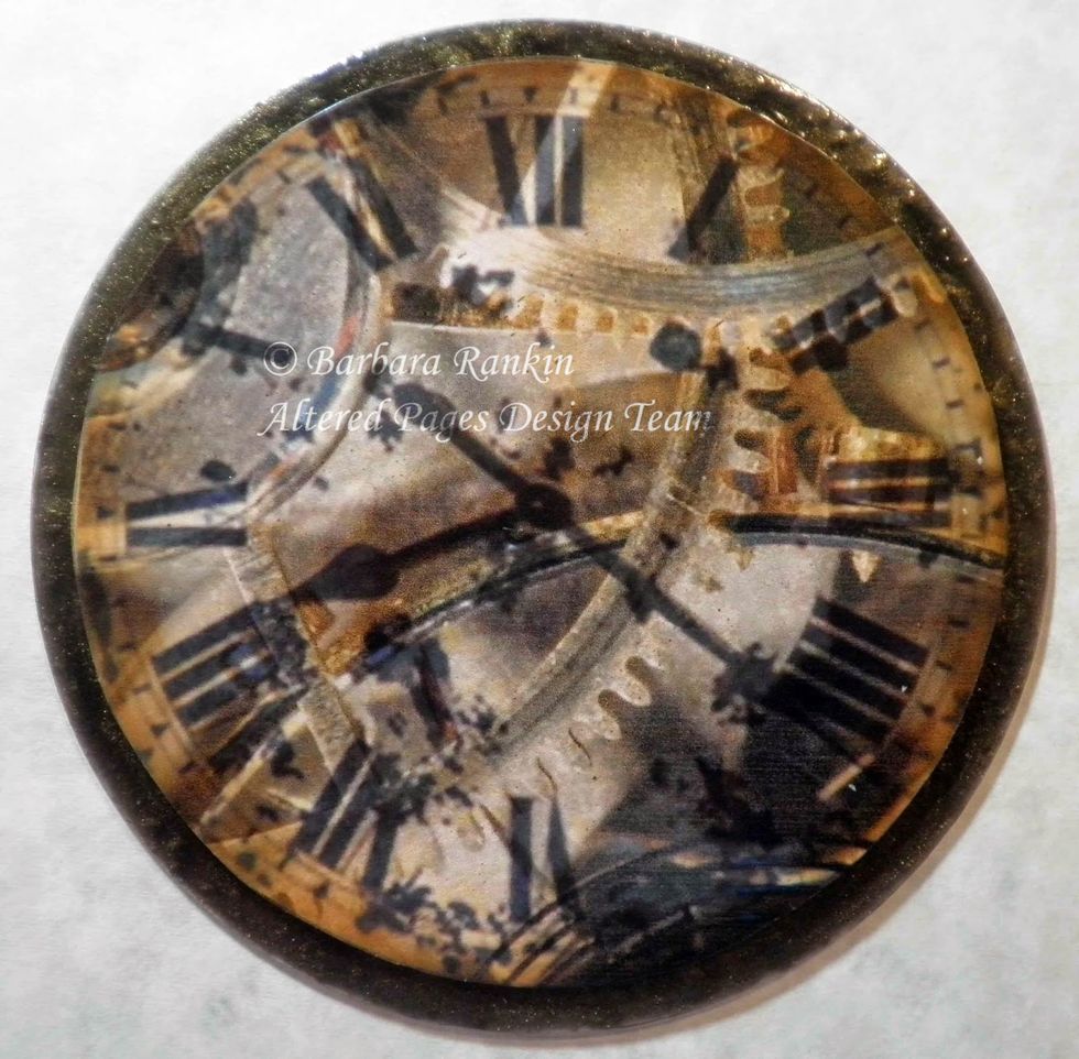 Center clock face coaster image over CD and adhere with tacky glue. Trim excess acetate and Voila! You have now integrated the gears background with the clock face, to make them look as one.