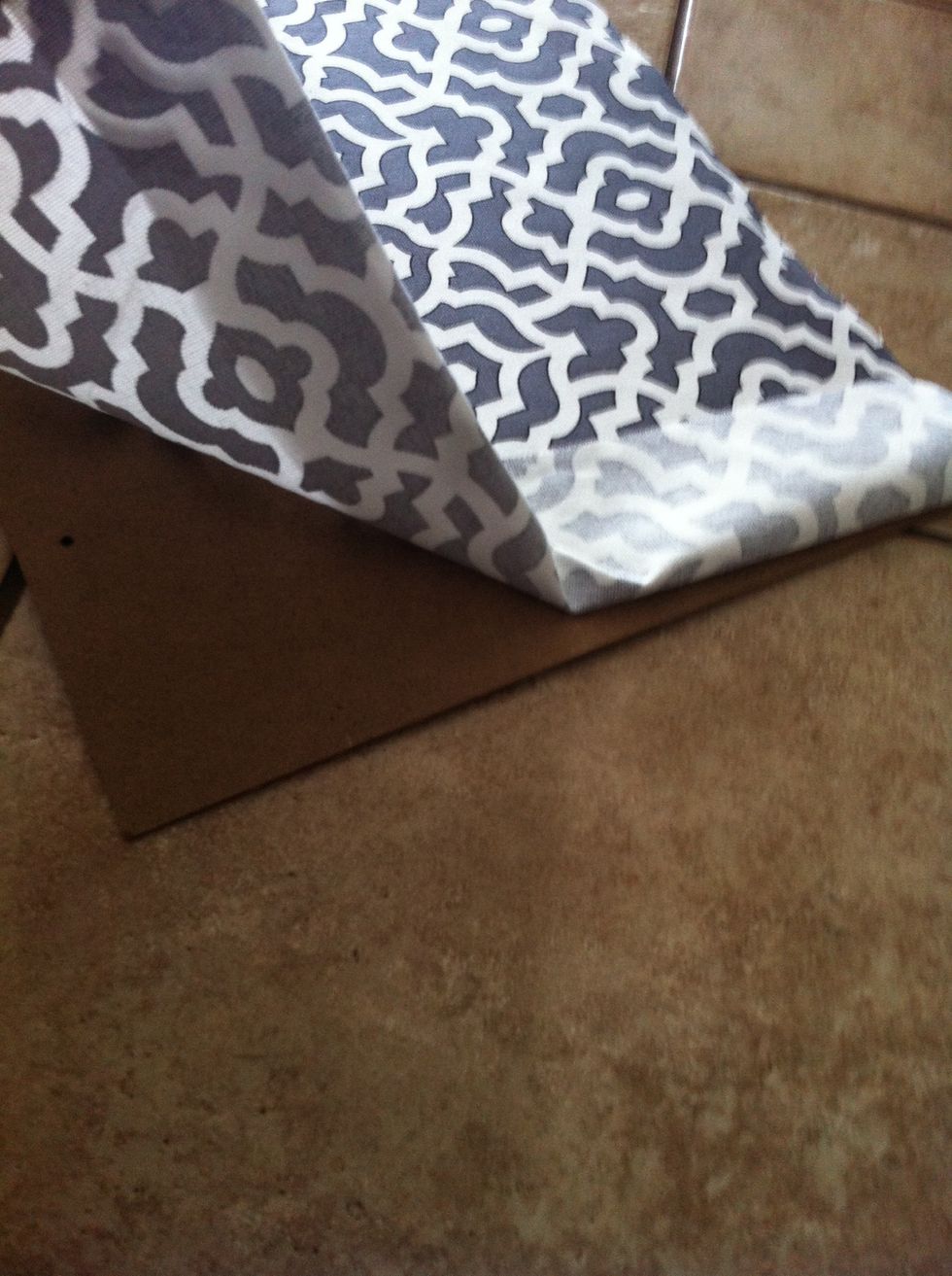 Center the fabric with the backboard based on your fabric's design and use glue dots to secure it in the middle