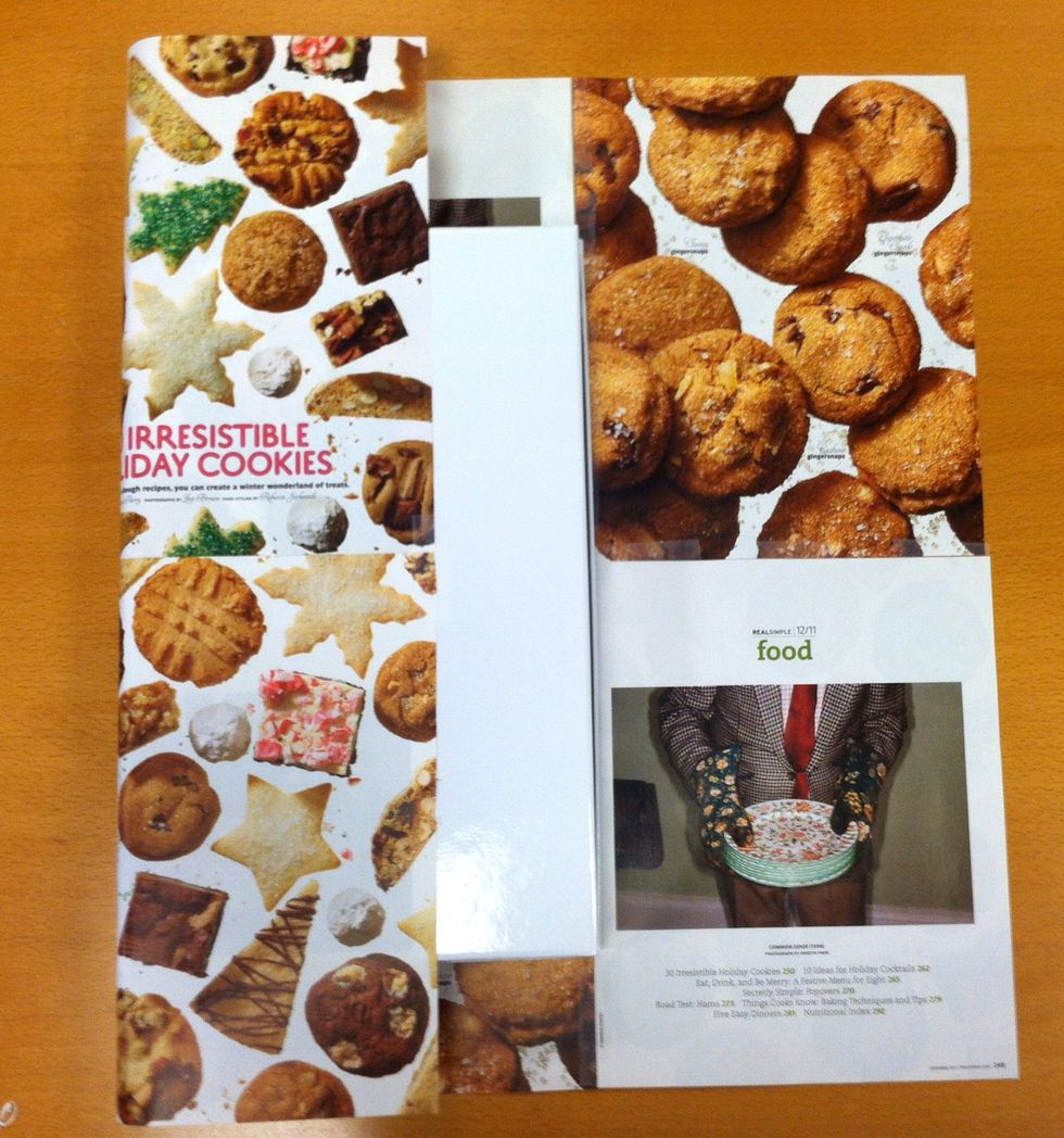 Center the present on the paper. Bring one side of the paper up the side and halfway across the top, hold in place. Now bring the other side up so it overlaps the first one and affix with tape.