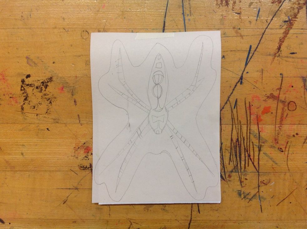 Center your drawing over the styrofoam and tape it into place.