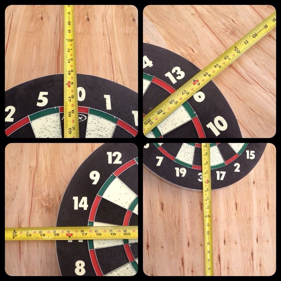 Centered the dart board on the wood