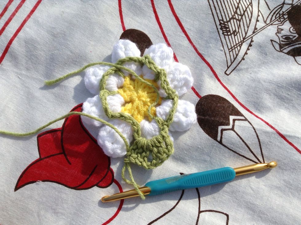 Ch 3, 2 dc, ch 2, 3 dc in the same loop. This is the 1st corner of your square.