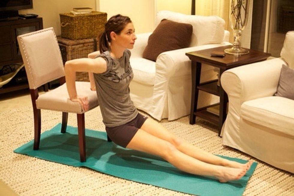 Chair-Ups: Good-bye arm jiggle, hello muscle! Place hands on edge of chair, shoulder width apart. Start with arms straight, then lower so you are almost sitting down. Hold, then come up. Complete 30