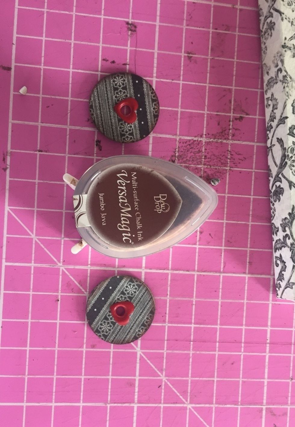 chalk edges of circles, lay two together and add eyelet or brad