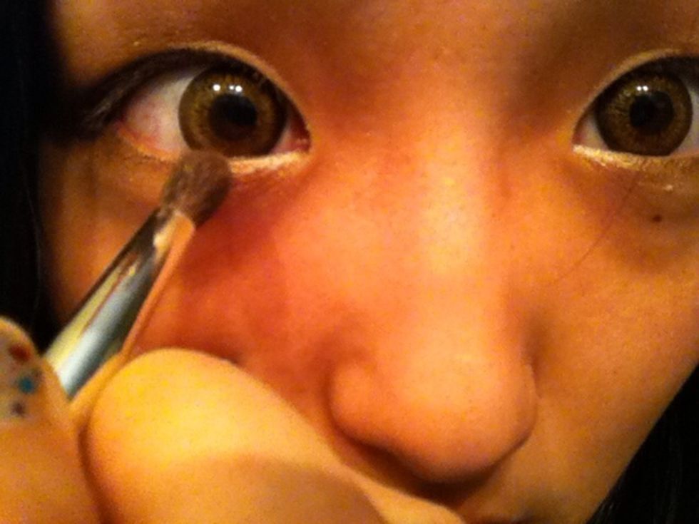 change to the smaller brush and brown eyeshadow.