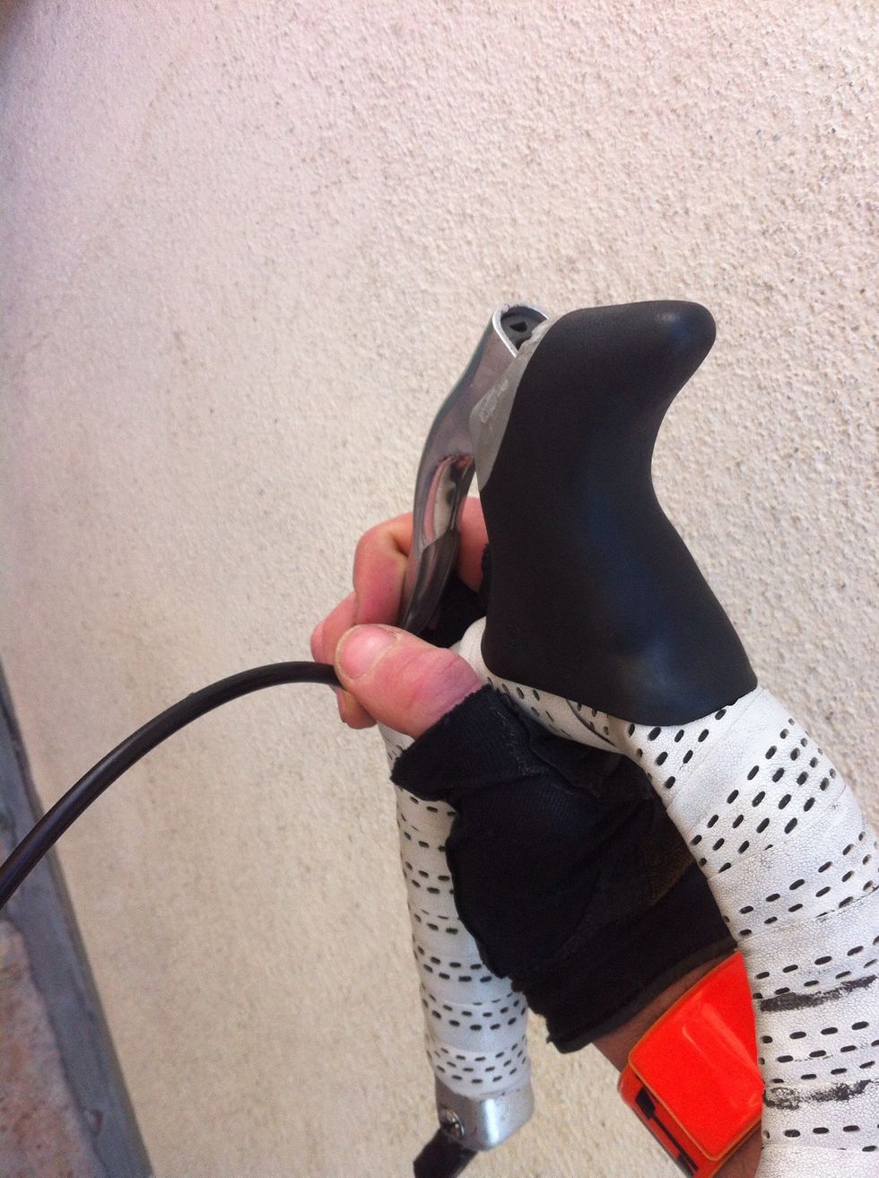 Check both brakes for necessary breaking force. Squeeze brakes tightly and push bike forward then back until opposite wheel lifts off the ground.