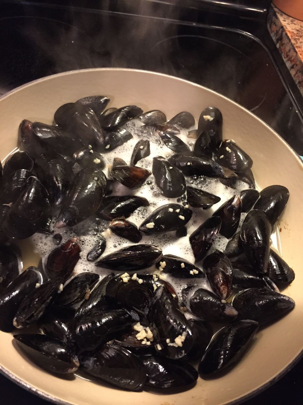 Check mussels. When the shells open, they are done!