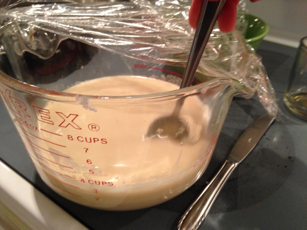 Check on the soap every five minutes and stir it. We are waiting for the soap to thicken up about twice as thick as it's original consistency.