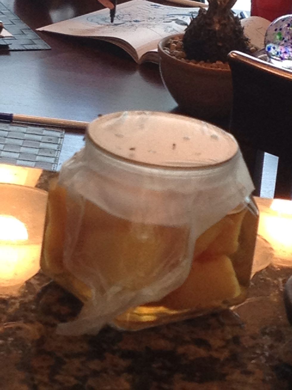 Check out the fruit fly party. The flies were attracted to it as soon as I put it down. Note the flies on the side. Next step addresses the ones that don't crawl into the trap.