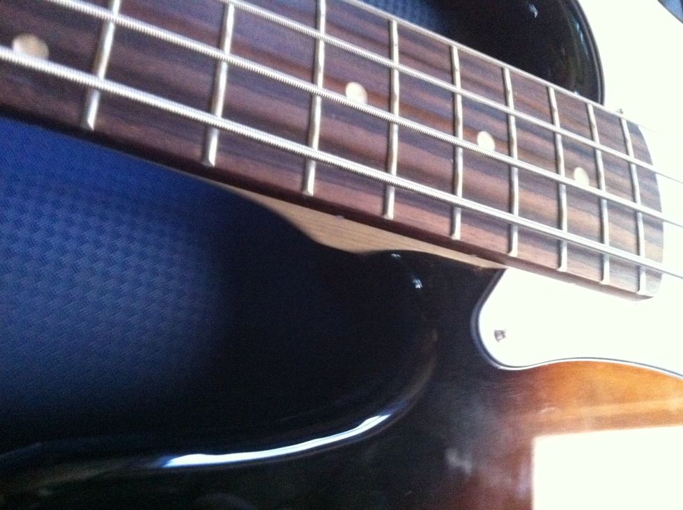 Check the area where the neck meets the body for cracks or other damage.