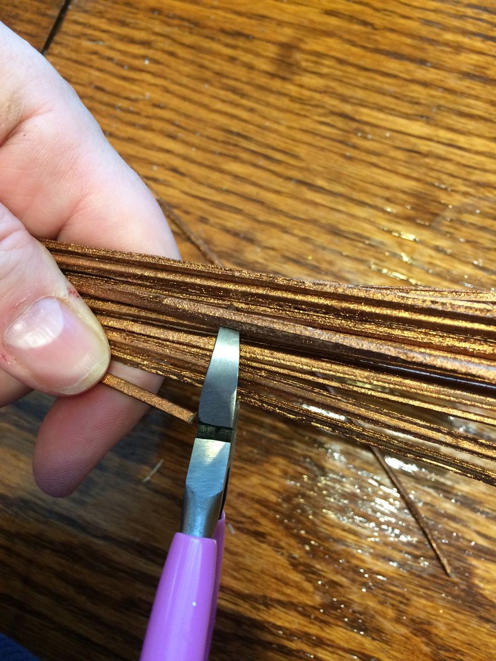 Check the height of the twisted wooden filler and trim to the height you want. I took off a few inches so the were shorter than the tall feature pieces.