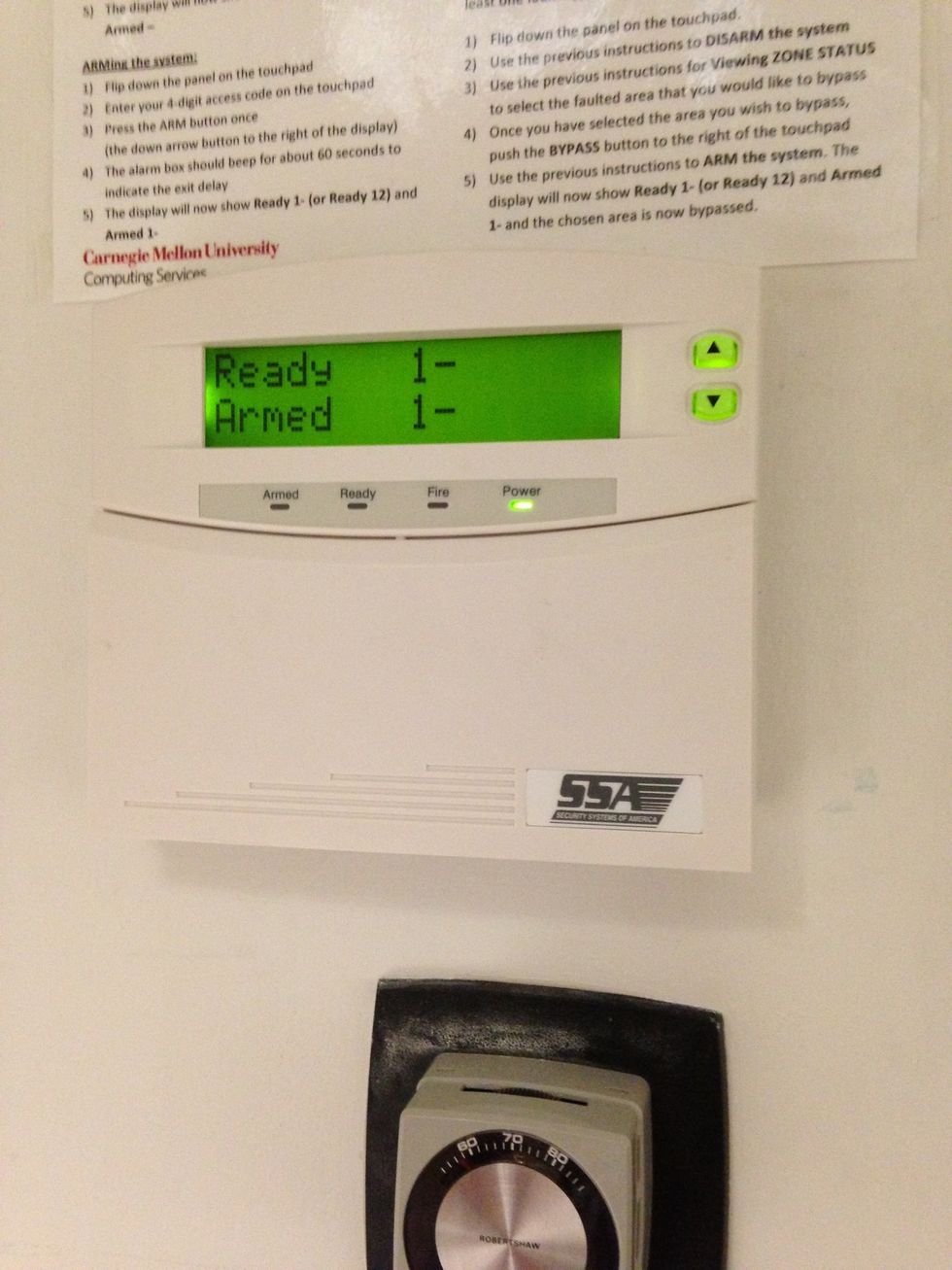 Check to see if the alarm is armed. There should be a 1 next to both Ready and Armed. If it isn't, call Campus Police and ask them to arm it.