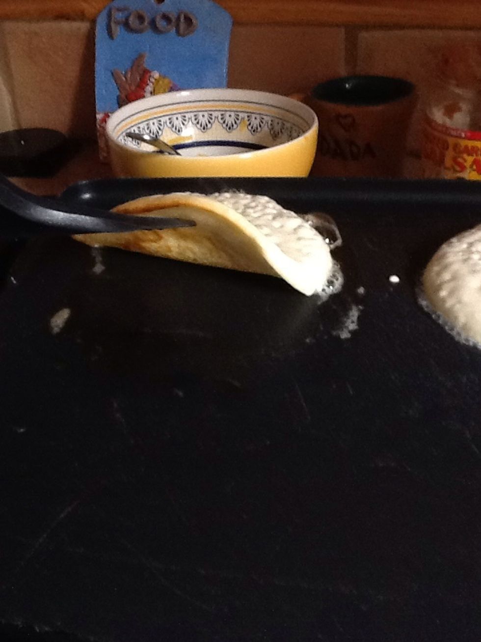 Check to see when to flip. When golden brown, flip.