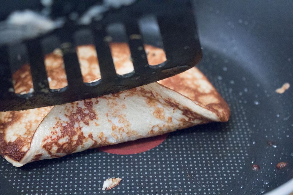 Check underneath to see progress of how well its cooking. Once lightly browned, transfer to a plate.