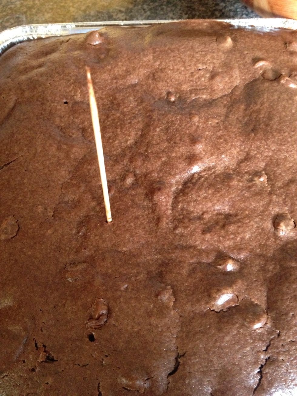 Check with a tooth pick, you will find that it's gooey on the bottom