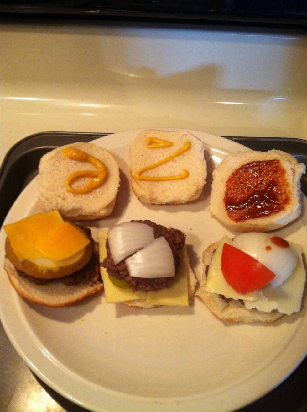 Cheddar burger - pear, cheddar, honey mustard; garlic pepper burger - mozzarella, dill pickle, onion, yellow mustard; hot red pepper burger - pepperjack, tomato, onion, BBQ sauce.