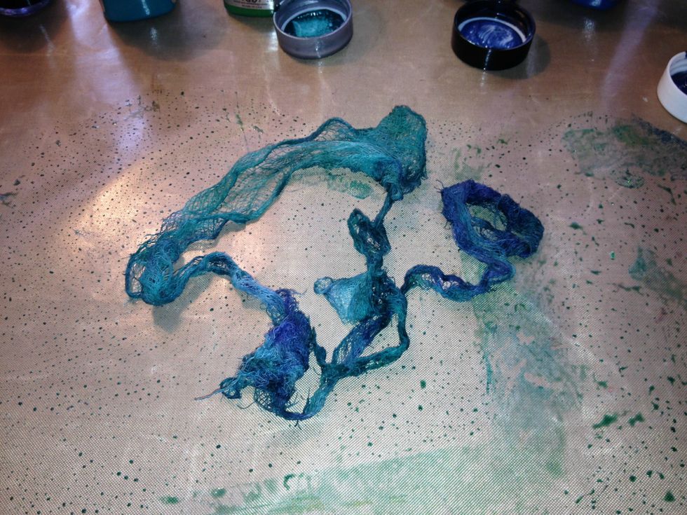Cheesecloth is an inexpensive way to provide wonderful texture to your projects. Cut off a piece and saturated it with Gemstone-Blue Topaz and Sorbet-Veridian... allow to dry.