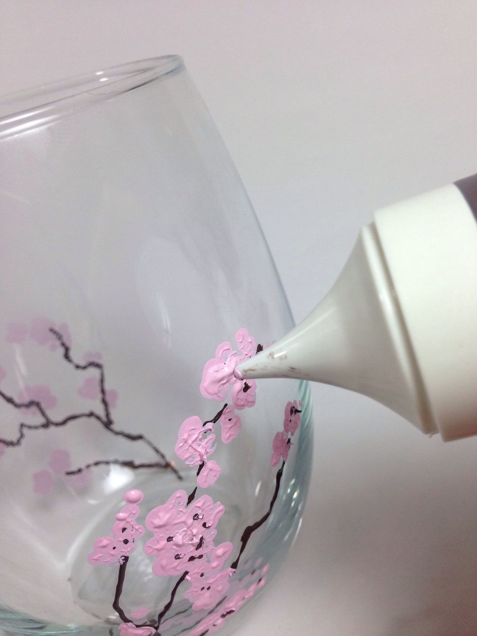 Cherry blossom petals are arranged in a pattern of five