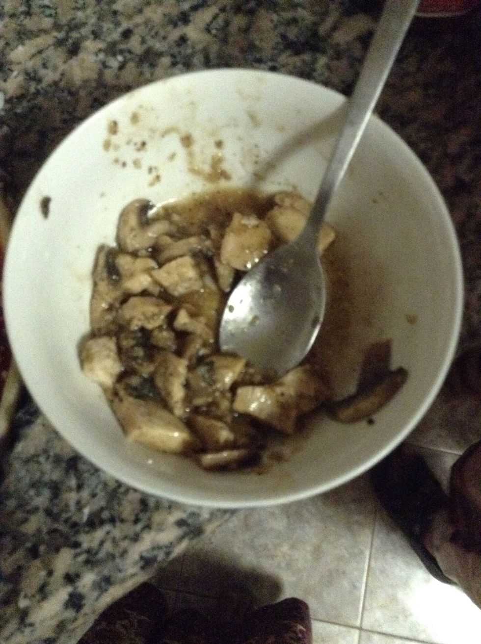 Chicken cooked with mushrooms, a onion clove, soya sauce, vinegar and salt per taste