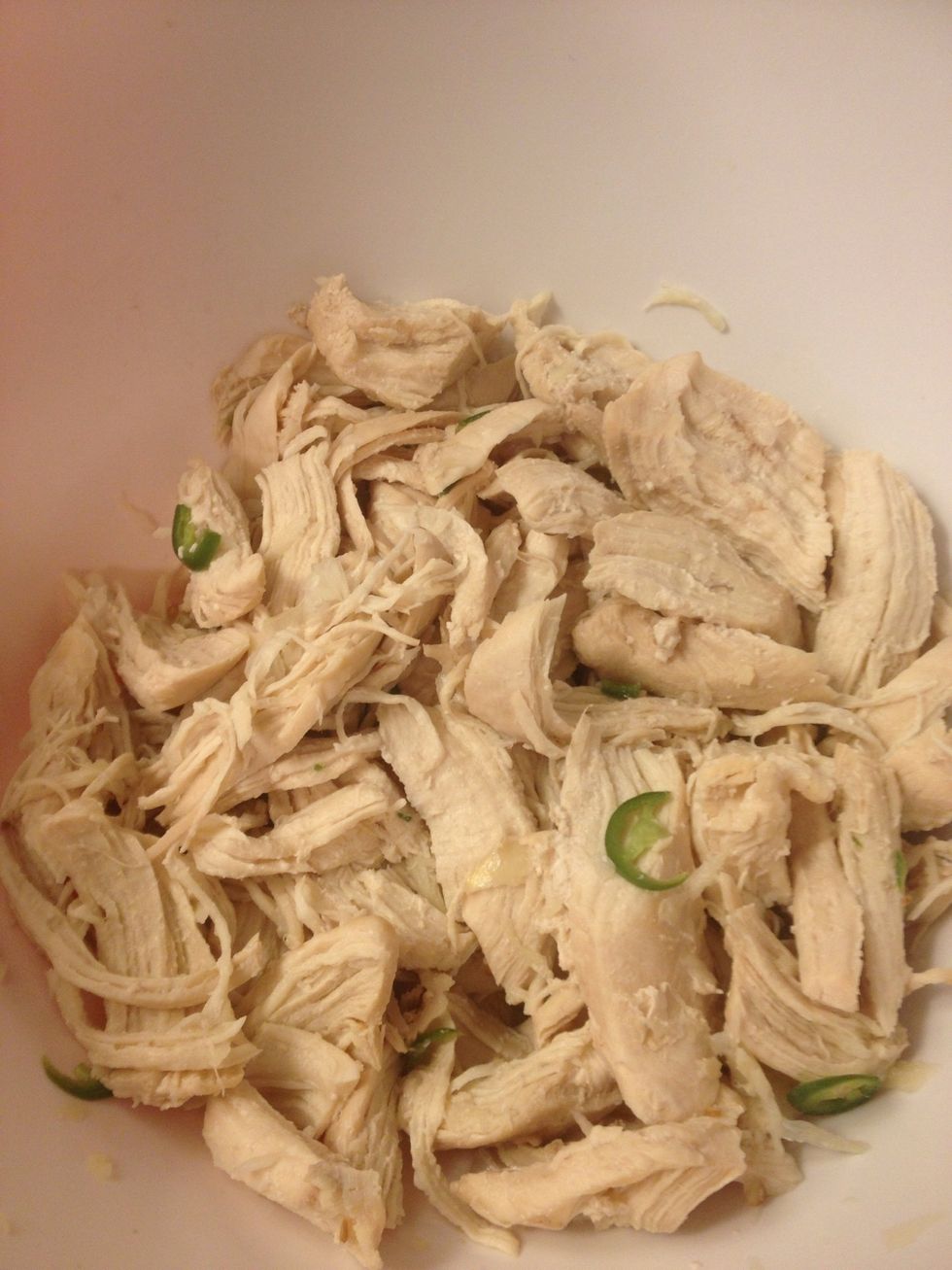 Chicken ; while boil it add 2 glove if garlic onion ,cienmon and two bay leaf for flavor after add two glove of garlic to 1/4 cup of vinegar iadd some hot jalape\u00f1o stir all together to look like pic