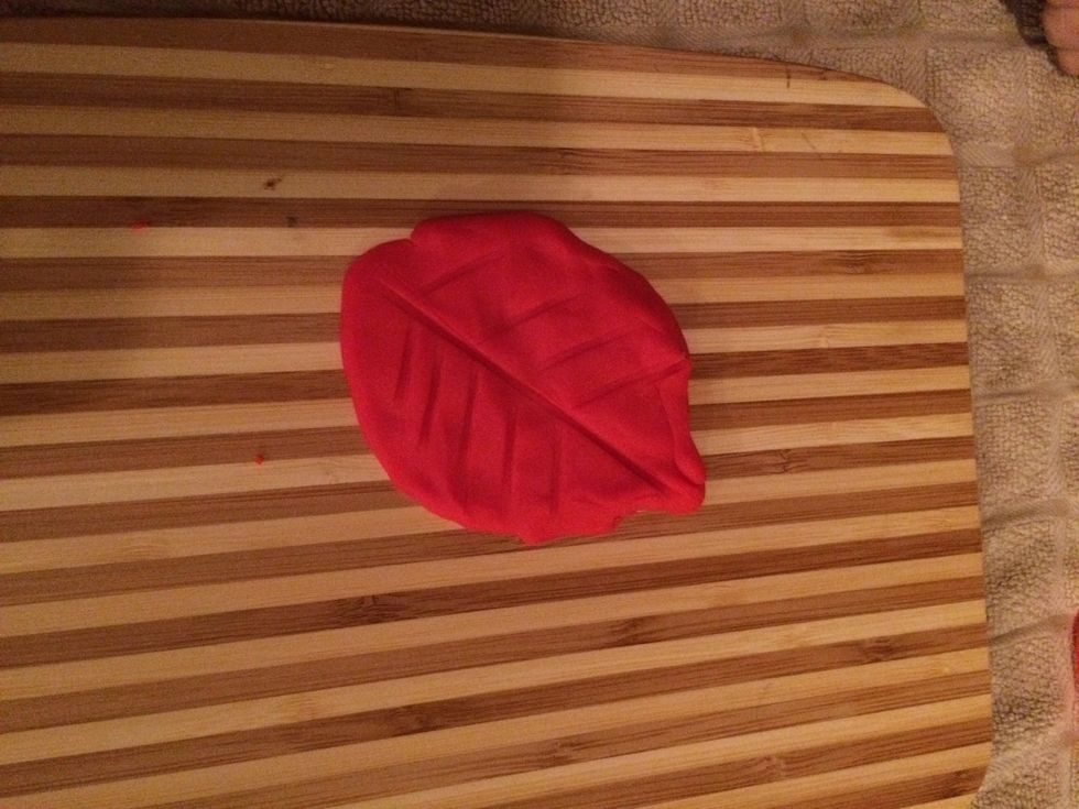 Chiffonade Flatten your dough into a leaf shape.