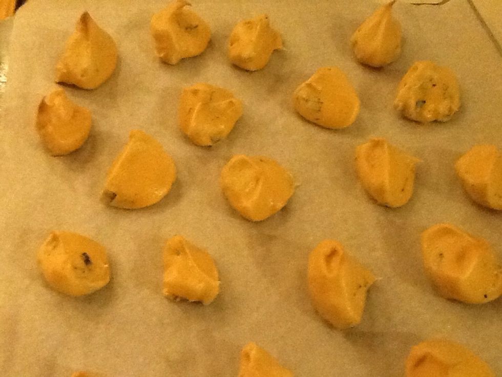 Chocolate chips meringue spoon dropped on parchment. Bake in 350\u00b0 for 7 min, turn down to 200\u00b0 for one hour, turn oven off and leave in oven to cool 3 hours or overnight. They dry up crispy, crunchy.