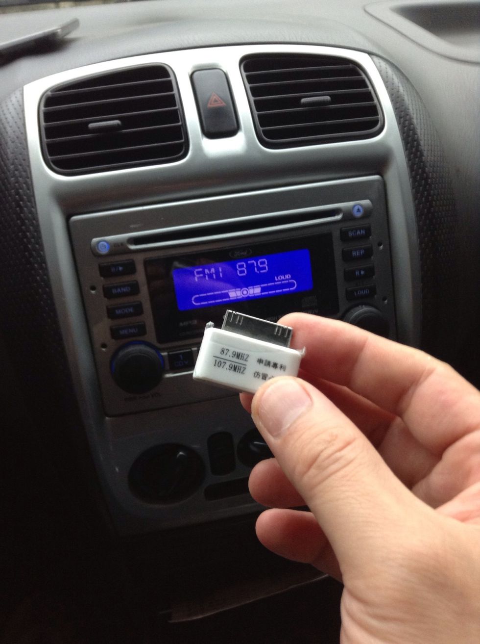 Choose 87.9FM and set your car radio accordingly.