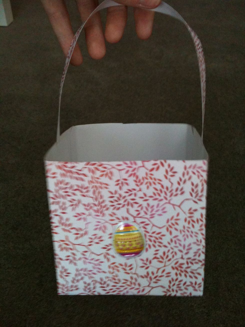 Choose a easter themed sticker and stick it on the side you can also put other accessories on it for example i used a ribbon in one that i made