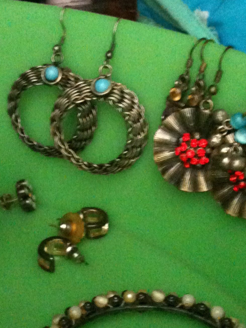 Choose a nice colourful basket. Hang your earrings in pairs all around the rim of the basket.