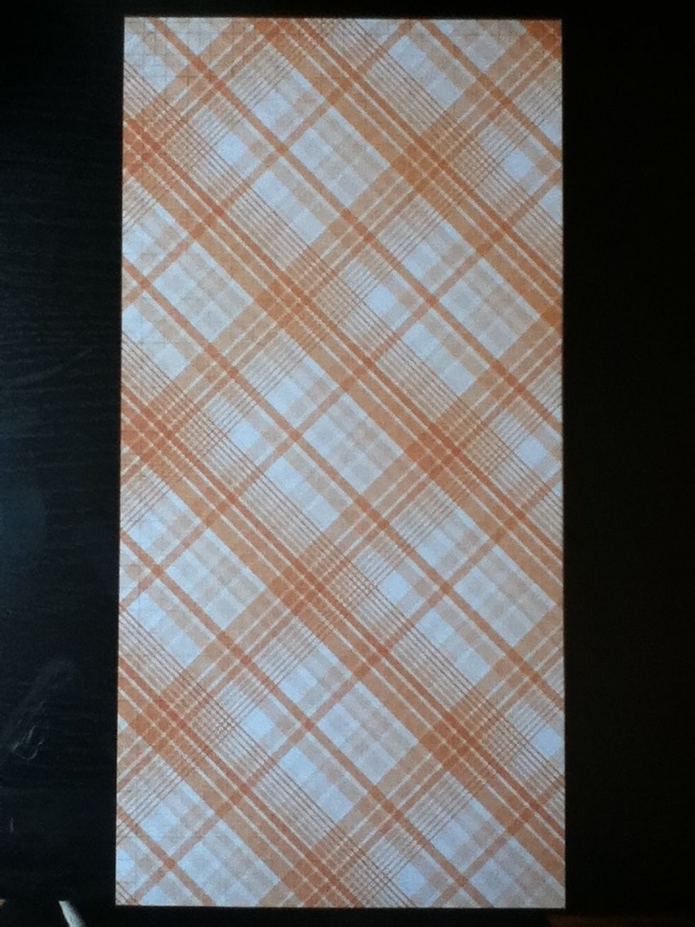 Choose a piece of patterned paper that you would like to use as the cover for your tin.