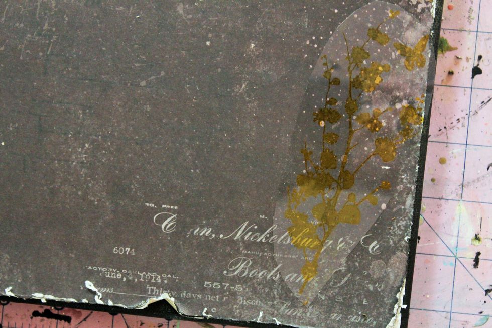 Choose a Prima adhesive rub on of your choice and adhere to the lower right corner of the canvas.