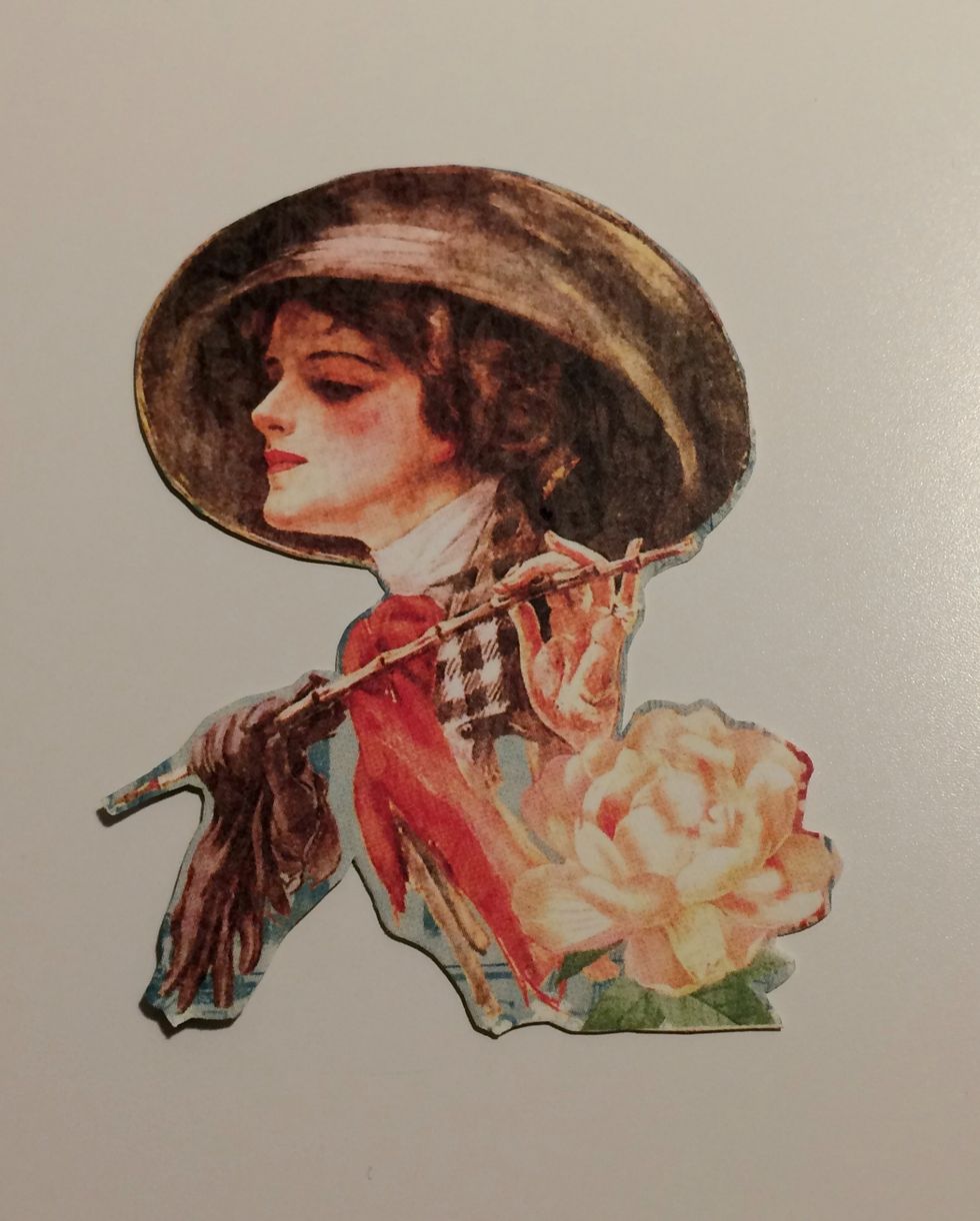 Choose and fussy cut a lady from the My Fair Lady paper.