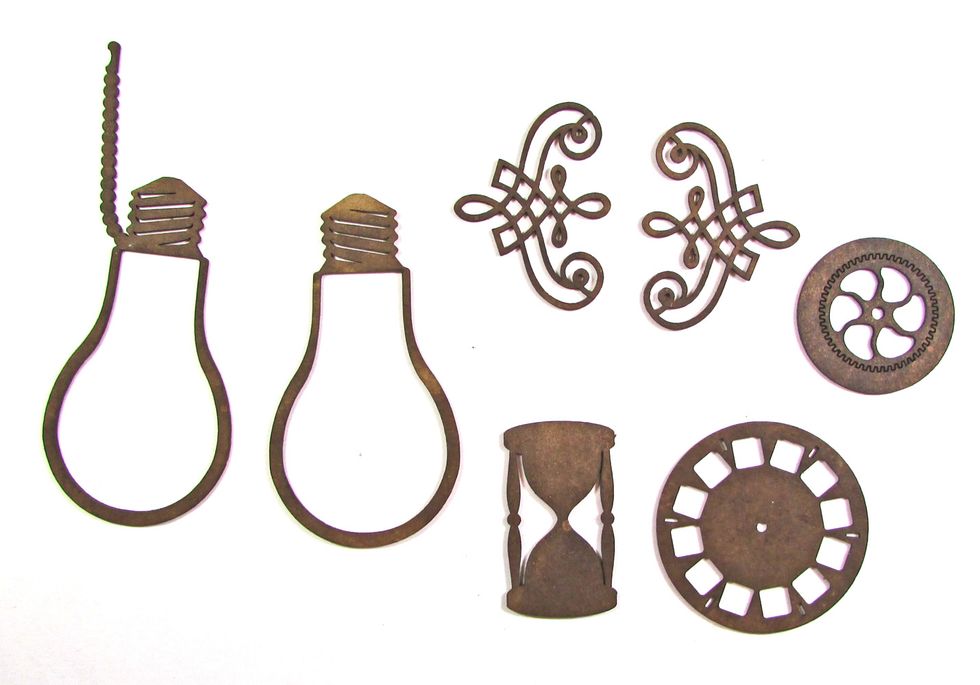 Choose GSL chipboard shapes to decorate your charging station. For a list of items used, see the supply list. Color each shape with distress ink.