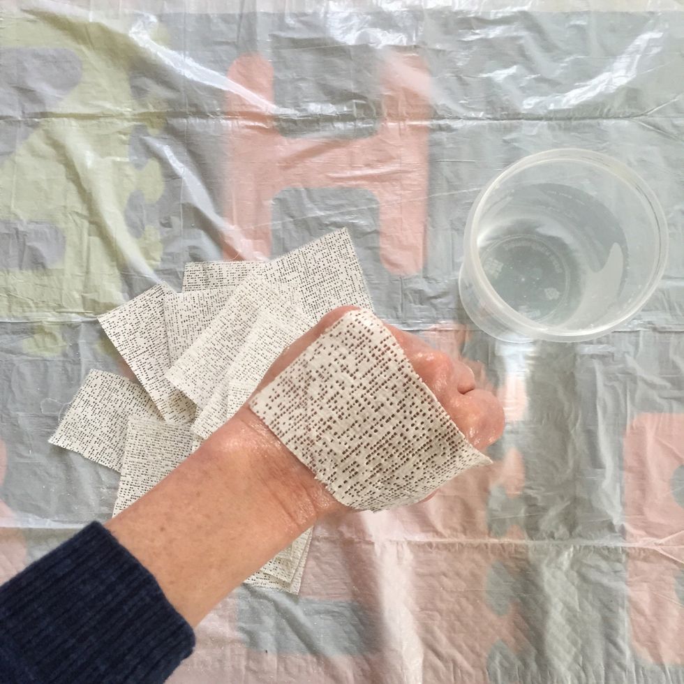 Choose hand position and begin applying plaster strips ensuring that your hand stays still in its position