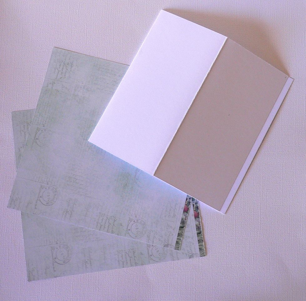 Choose the green papers from the small Magnolia Lane paper pad - score the front half of the square white card in half.