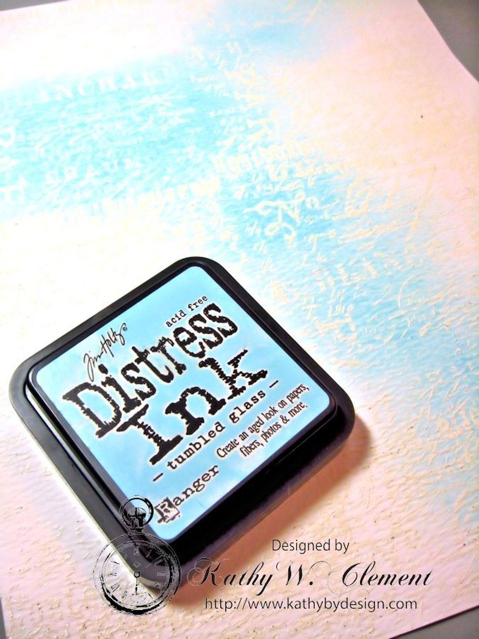 Choose the lightest color, and use a foam ink applicator tool to apply it randomly over the stamped and embossed background. See how the embossing does not take the color? This is called a resist.