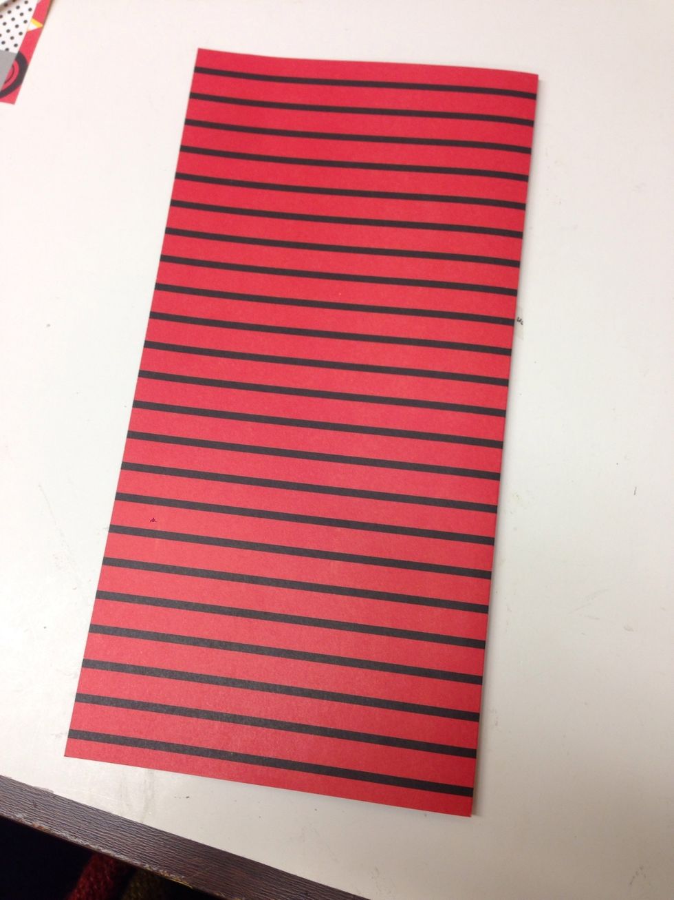 Choose the paper for the cover of your album, fold in half and crease well.