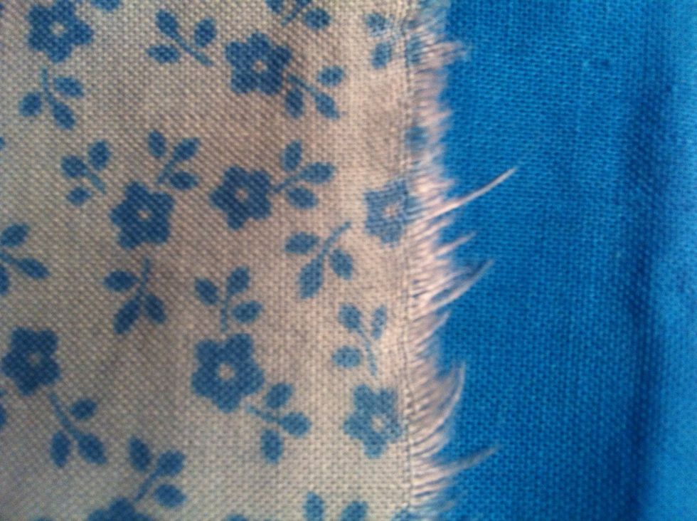 Choose two different fabrics. I like to make them match (: The plain one is going to be used on the inside, and the patterned one is for the outside of the case.