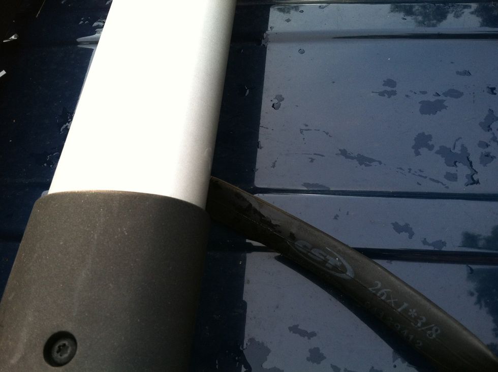 Choose where you want to place the fork mount. If your cross bars are bowed - place the mount in the middle so your bike won't lean to the side. Get your tube and start wrapping the cross bar.