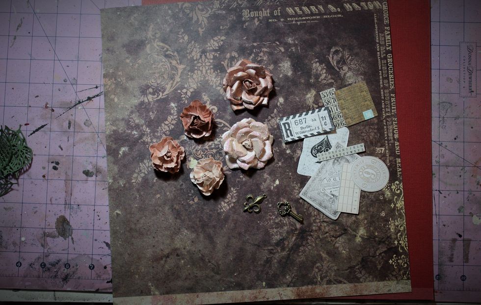 Choose your card stock and one sheet of patterned paper from the main kit. Pull out some of the ephemera included along with five of the Prima flowers. Here's what I used if you want to follow along.