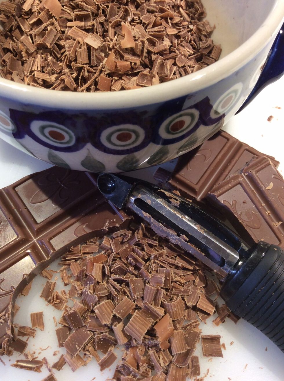 Choose your favorite; milk or dark chocolate and then use a vegetable peeler to shave the chocolate.