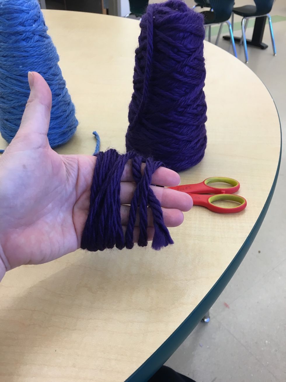 Choose your next color. Wrap it around your hand 10 times and cut.