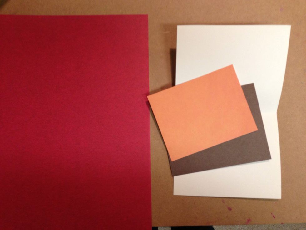 Choose your own colors; I chose a typical fall palette. You need a card (shown in white). A frame color (shown in brown). A top color (shown in orange). A leaf cutout color (shown in burgundy).