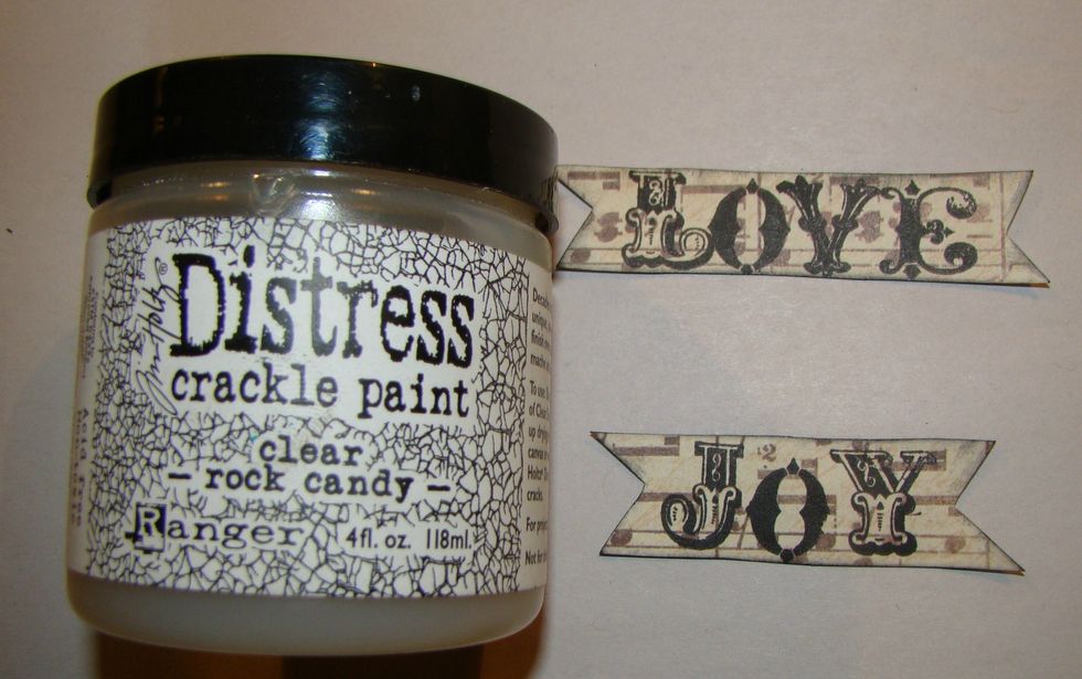 Choose your paper and stamp you sentiment. Cut it in a banner. Ink the edges. Give a good coat of crackle paint and allow to dry completely.