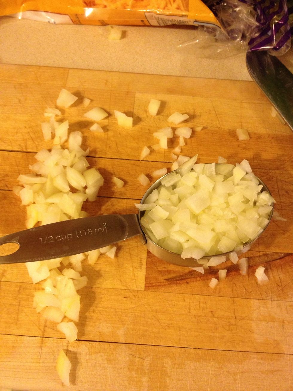 Chop 1/2 cup of onions. Place in a bowl.