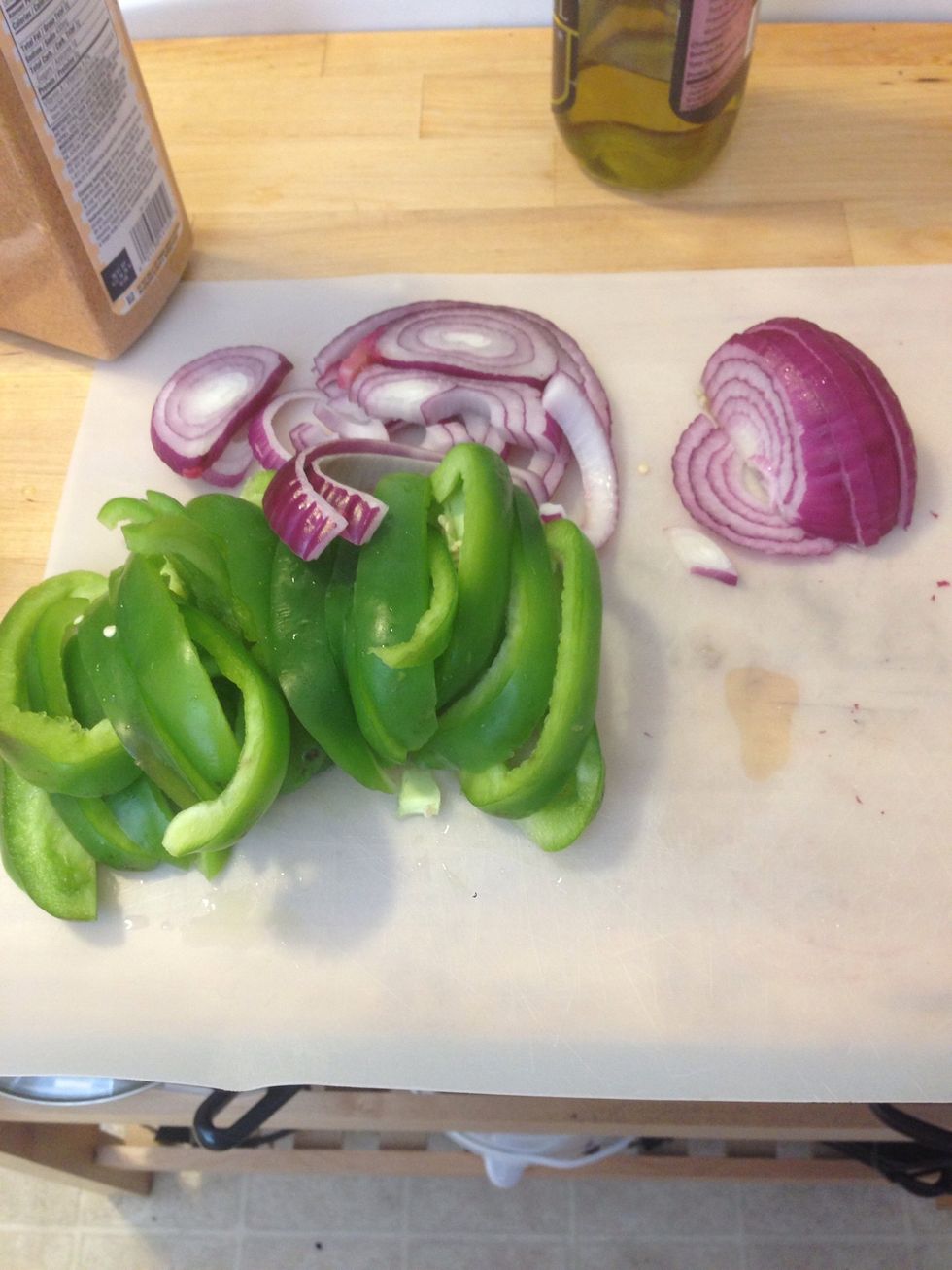 Chop 1/2 onion and 1 bell pepper. I know these are sliced, but they were hard to eat on the pizza. Chopping them would make it easier to eat.
